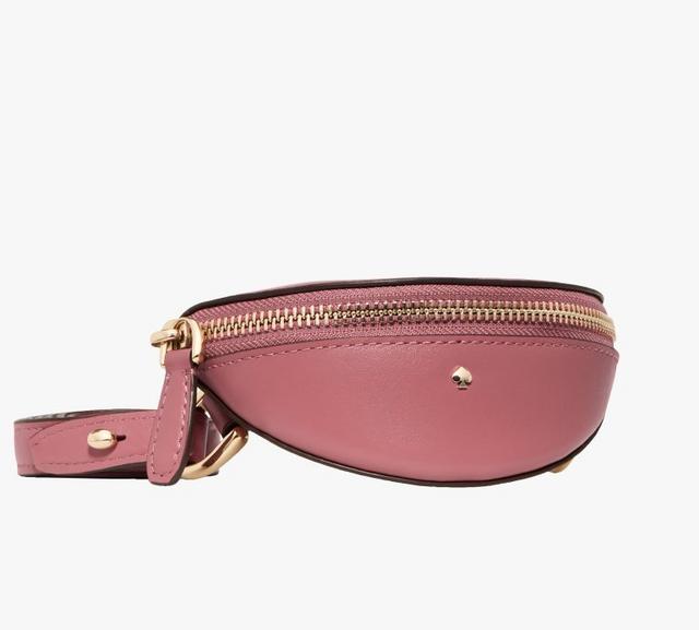 Pink leather belt bag with gold-tone zipper and adjustable strap.