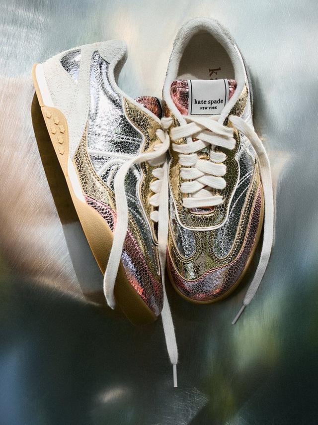 Kate Spade New York sneakers with metallic multicolored finish and white laces.