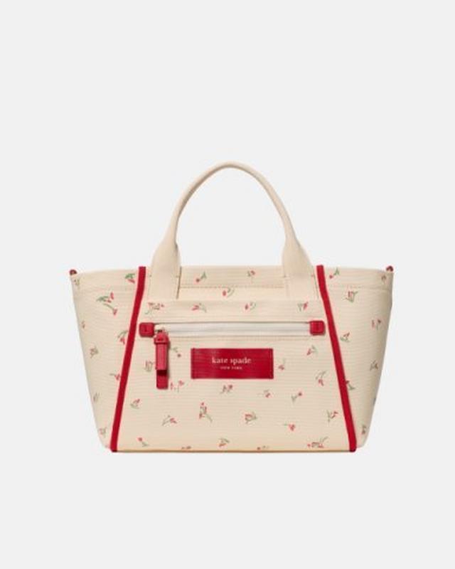 Kate Spade tote bag in cream with red floral print and red trim details.