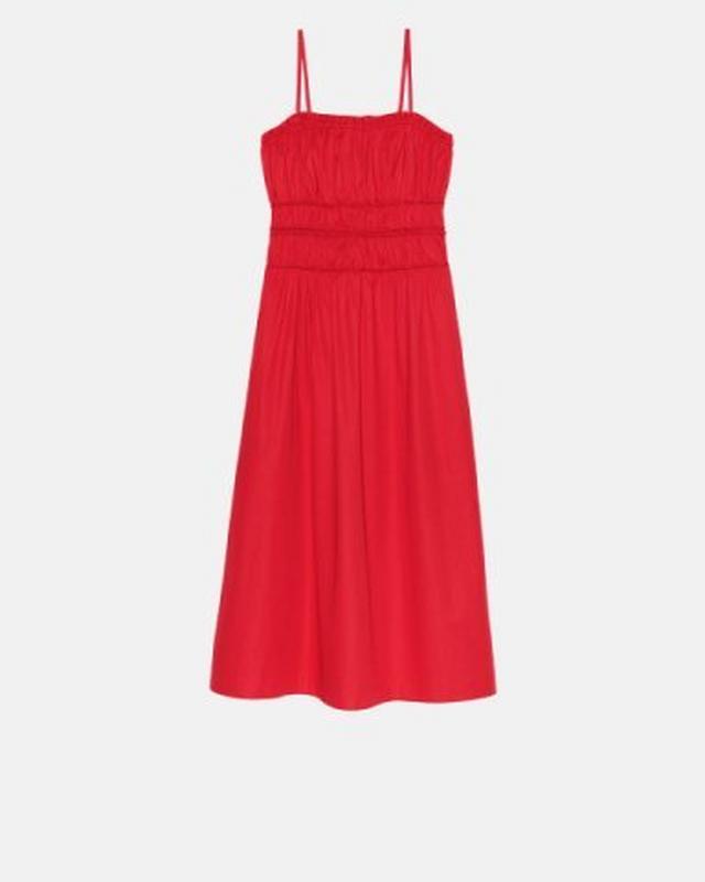 Red midi dress with gathered bodice, thin straps, and elasticated waist detail.