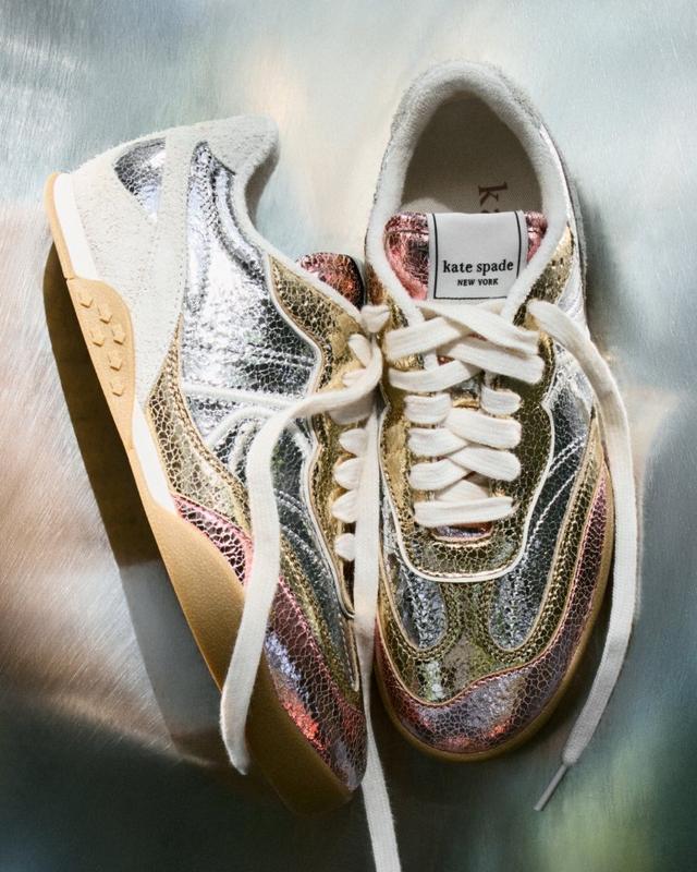 Kate Spade New York sneakers with metallic multicolored textured finish and white laces.
