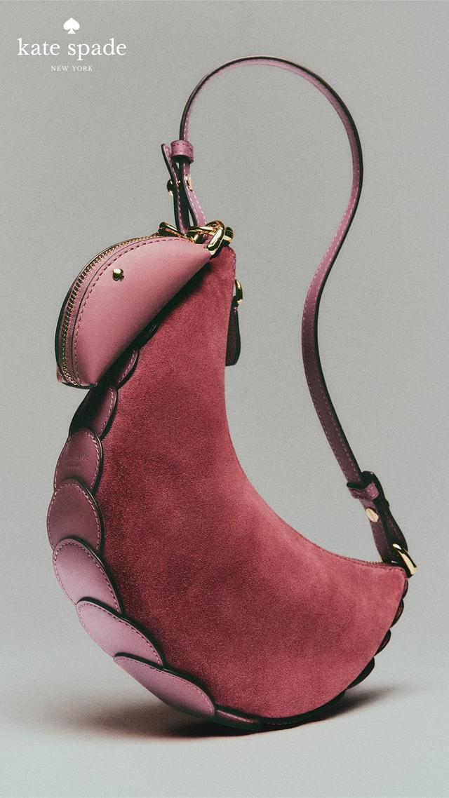 Kate Spade pink suede swan-shaped handbag with scalloped detailing and adjustable strap.