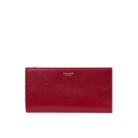 Kate Spade red leather slim bifold wallet with gold logo plaque and zip pocket.