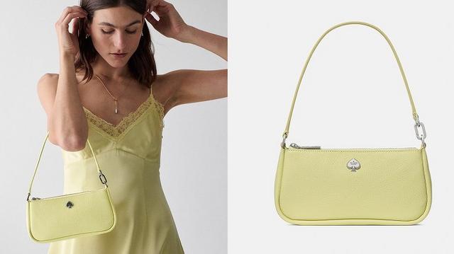 Woman wearing yellow slip dress carrying the Kate Spade Outlet Kayla bag in lime slushy