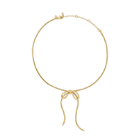 Gold-tone bangle bracelet with dangling snake charm.