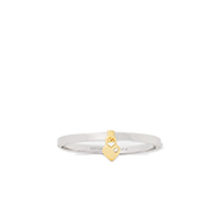 Silver band ring with small gold-tone decorative accent in center.