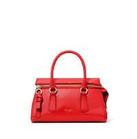 Red structured handbag with dual top handles and decorative buckle straps on the front.