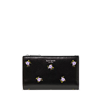 Black card holder with five floral embellishments arranged in a pattern.