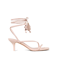 Pale pink strappy kitten heel sandal with ankle wrap ties and tassel detail.