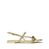 Gold metallic flat sandal with crisscross ankle straps and a textured finish.