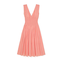 Sleeveless coral pink dress with v-neckline, fitted waist, and pleated knee-length skirt.