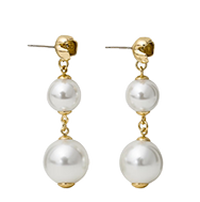 Gold-toned stud earrings with dangling white pearls, featuring two graduated pearls per earring connected by gold links.