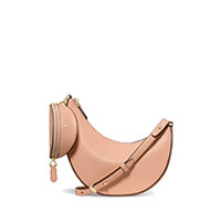 Tan leather crescent-shaped crossbody bag with adjustable strap and small gold hardware accents.