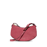 Pink suede crossbody bag with adjustable shoulder strap and curved silhouette.