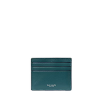 Teal leather card holder with multiple card slots and Kate Spade New York logo in gold lettering.